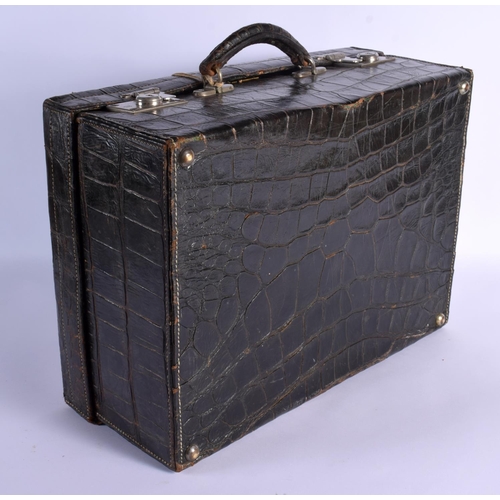 739 - A VINTAGE CROCODILE SUITCASE. 43 cm x 30 cm x 22 cm.