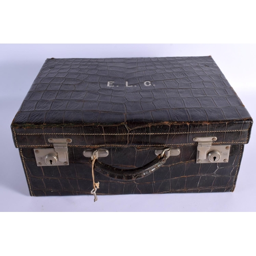 739 - A VINTAGE CROCODILE SUITCASE. 43 cm x 30 cm x 22 cm.