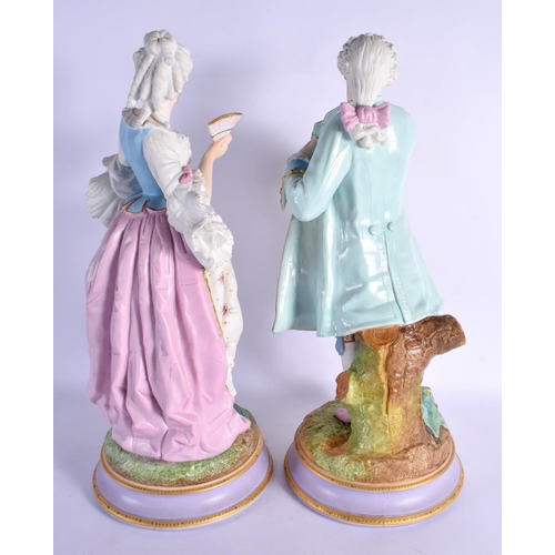 74 - A LARGE PAIR OF 19TH CENTURY FRENCH PARIS PORCELAIN FIGURES modelled upon naturalistic bases. 48 cm ... 