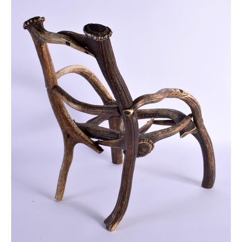 740 - A RARE CHILDS TAXIDERMY CARVED ANTLER CHAIR. 45 cm x 23 cm.