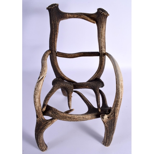 740 - A RARE CHILDS TAXIDERMY CARVED ANTLER CHAIR. 45 cm x 23 cm.