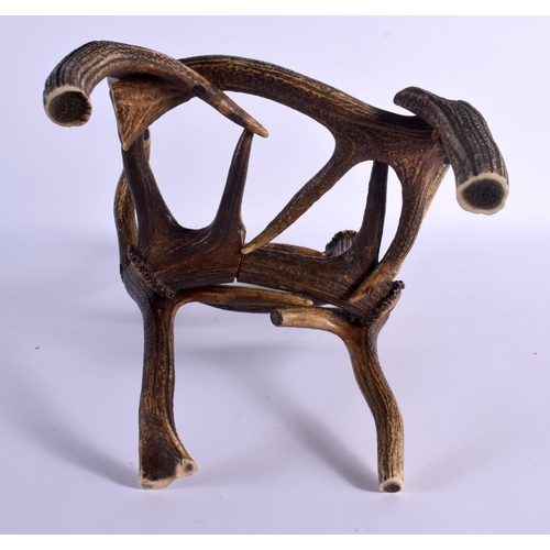 740 - A RARE CHILDS TAXIDERMY CARVED ANTLER CHAIR. 45 cm x 23 cm.