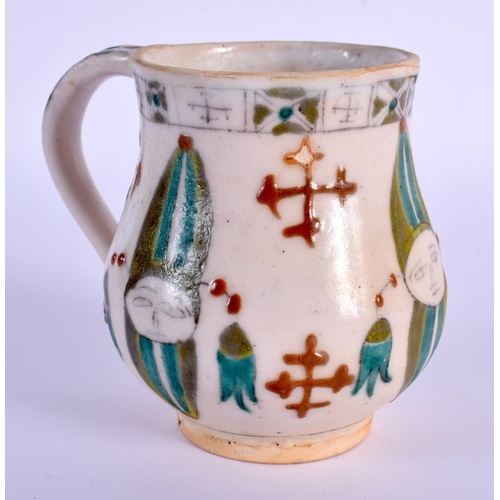 745 - AN OTTOMAN TURKISH KUTAHYA HOLY WATER CUP painted with figures. 9 cm x 9 cm.