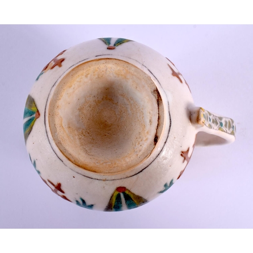 745 - AN OTTOMAN TURKISH KUTAHYA HOLY WATER CUP painted with figures. 9 cm x 9 cm.