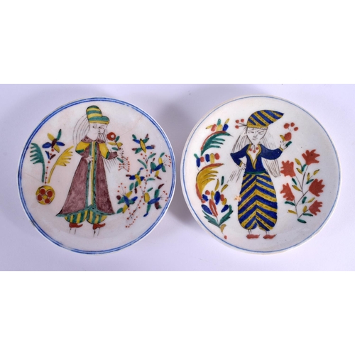 746 - A PAIR OF TURKISH OTTOMAN KUTAHYA PLATES painted with figures. 13 cm diameter.