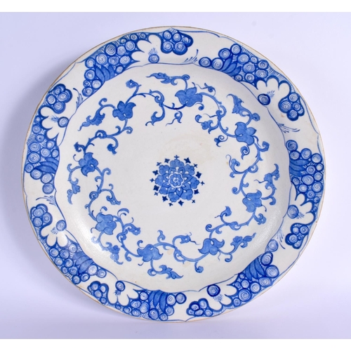 748 - A RARE OTTOMAN TURKISH BLUE AND WHITE PLATE painted with flowers. 30 cm diameter.