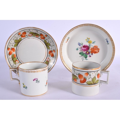 77 - TWO 19TH CENTURY CONTINENTAL PORCELAIN CUPS AND SAUCERS painted with flowers. 10 cm diameter. (4)