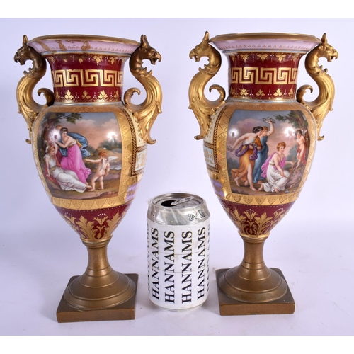 99 - A PAIR OF 19TH CENTURY TWIN HANDLED VIENNA PORCELAIN VASES with bronze mounts. 28 cm x 12 cm.