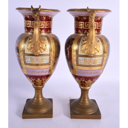 99 - A PAIR OF 19TH CENTURY TWIN HANDLED VIENNA PORCELAIN VASES with bronze mounts. 28 cm x 12 cm.