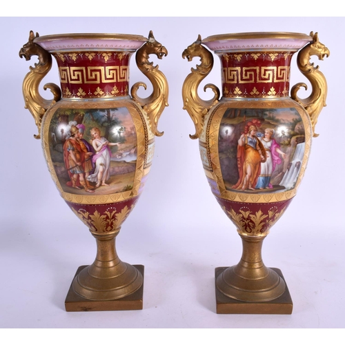 99 - A PAIR OF 19TH CENTURY TWIN HANDLED VIENNA PORCELAIN VASES with bronze mounts. 28 cm x 12 cm.