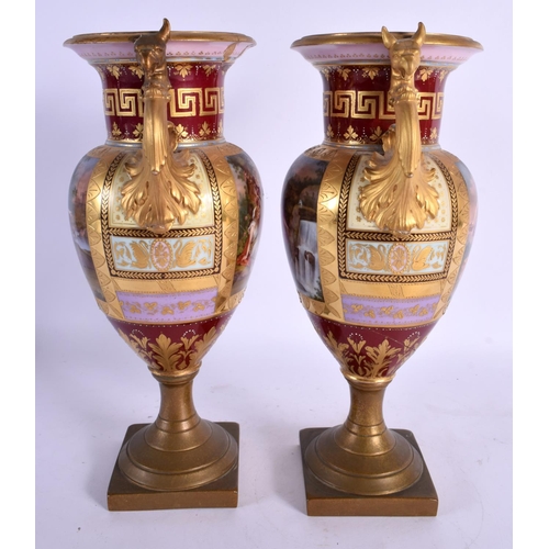 99 - A PAIR OF 19TH CENTURY TWIN HANDLED VIENNA PORCELAIN VASES with bronze mounts. 28 cm x 12 cm.