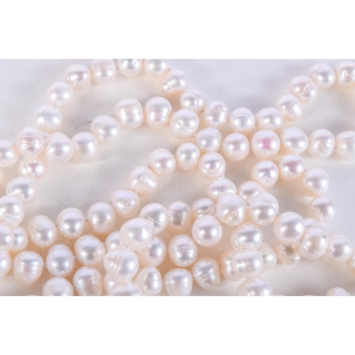 1004 - A STRING OF PEARLESCENT BEADS.  Length 128cm, bead size 9.2mm, weight 157g