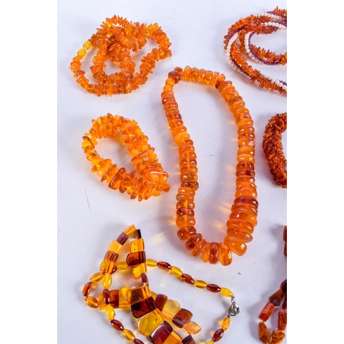 1013 - BAG OF AMBER TYPE NECKLACES.  Longest 66cm, weight 228g total (7)