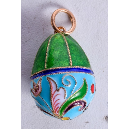 1035 - A CONTINENTAL SILVER AND ENAMEL EGG PENDANT.  Stamped 84, 3cm x 1.7cm, 5.8g