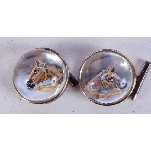 1069 - A CASED PAIR OF SILVER AND CRYSTAL HORSE HEAD CUFFLINKS.  Stamped Sterling, 2cm diameter, weight 15.... 