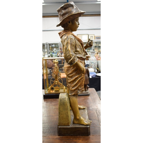 1453 - A LARGE ANTIQUE AUSTRIAN COLD PAINTED TERRACOTTA FIGURE OF A BOY modelled with one hand in his pocke... 