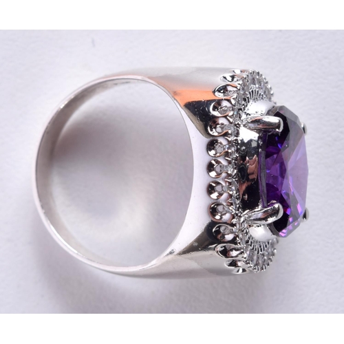 753 - AN AMETHYST TYPE RING.  Size N/O, Stamped 925, weight 7.1g