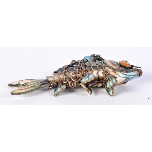 764 - A CLOISONNE ARTICULATED FISH PENDANT.  3.4cm x 7.4cm x 1.4cm, weight 18.7g