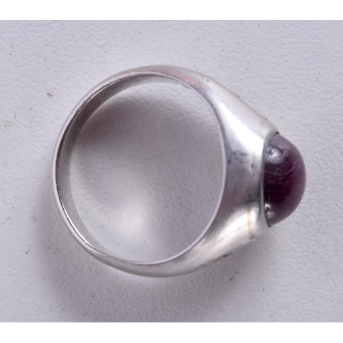 770 - A WHITE GOLD, DIAMOND AND RUBY CABOCHON RING.  Stamped 15K, Size L, weight 7g