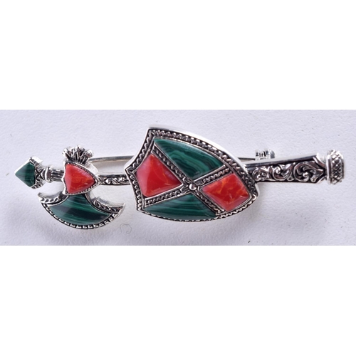 822 - A SILVER AND MALACHITE AXE AND SHIELD BROOCH.  Stamped Silver, 5.5cm x 2cm, weight 7.2g