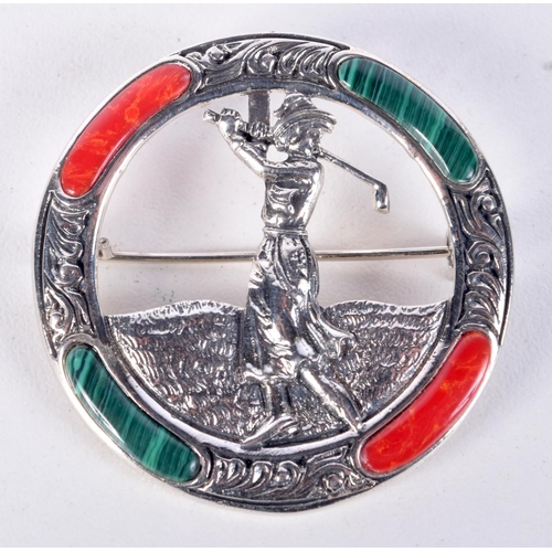 836 - A SILVER AND MALACHITE LADY GOLFER BROOCH.  Stamped Silver, 3.8cm diameter, weight 9g