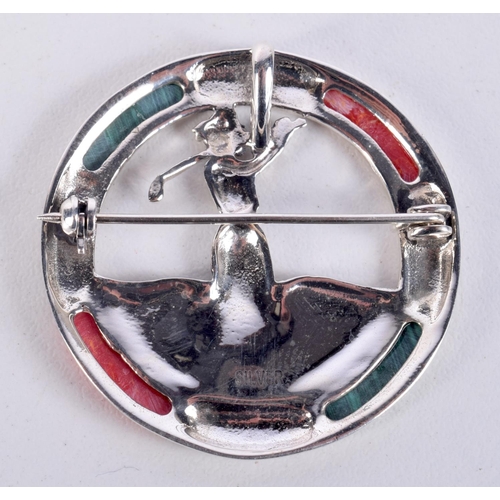 836 - A SILVER AND MALACHITE LADY GOLFER BROOCH.  Stamped Silver, 3.8cm diameter, weight 9g