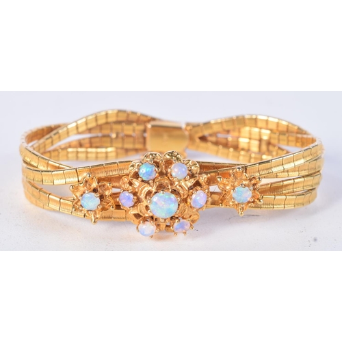 844 - A 14CT GOLD AND OPAL BRACELET.  Stamped 14K, Inside diameter 15.5cm, weight 24.4g