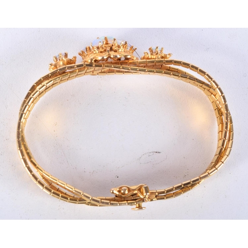 844 - A 14CT GOLD AND OPAL BRACELET.  Stamped 14K, Inside diameter 15.5cm, weight 24.4g