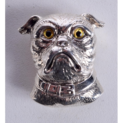 855 - A SILVER DOG BROOCH WITH GEM SET EYES.  Stamped Sterling, 2.8cm x 2.6cm, weight 12.1g