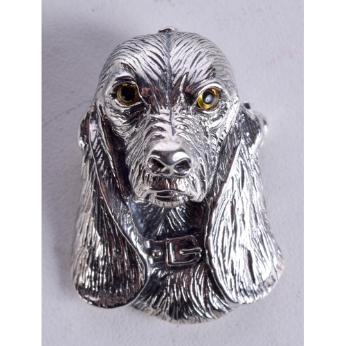 859 - A WHITE METAL DOG BROOCH WITH GEM SET EYES.  3.4cm x 2.4cm, weight 12.7g