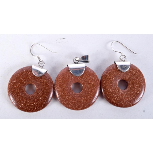 874 - A PAIR OF GOLDSTONE EARRINGS WITH MATCHING PENDANT.  4.8cm drop, weight 27.8g