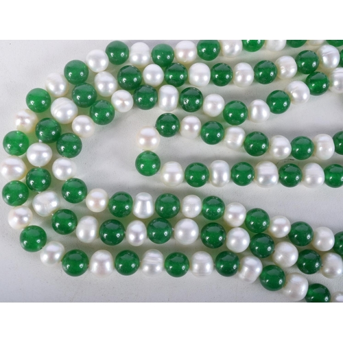 923 - A STRING OF JADE AND PEARL TYPE BEADS.  Length 120cm, Bead size 7cm, weight 112g