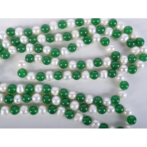 923 - A STRING OF JADE AND PEARL TYPE BEADS.  Length 120cm, Bead size 7cm, weight 112g