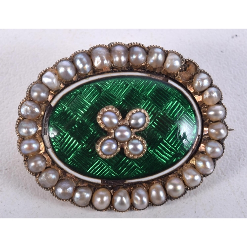 929 - AN ENAMEL AND SEED PEARL BROOCH.  2.8cm x 2.3cm, weight 8.4g