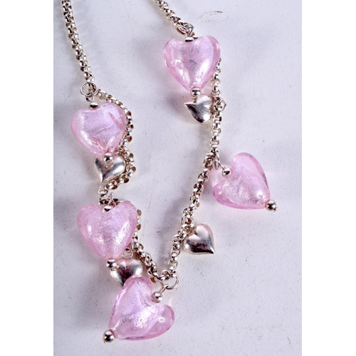 933 - A SILVER NECKLACE WITH HEART DROPLETS.  Stamped 925, length 46.5cm