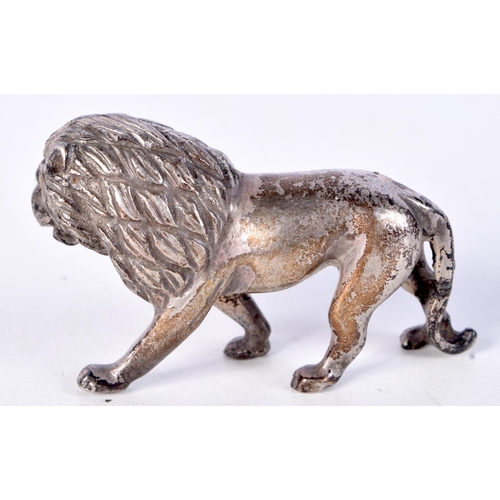 951 - A WHITE METAL MODEL OF A ROAMING LION.  6cm x 3.5cm, weight 64g