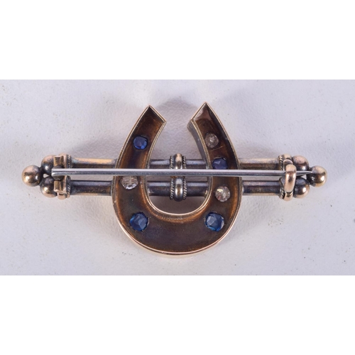 978 - A GOLD, DIAMOND AND SAPPHIRE HORSESHOE BAR BROOCH.  4.6cm x 2.4cm, weight 8.8g