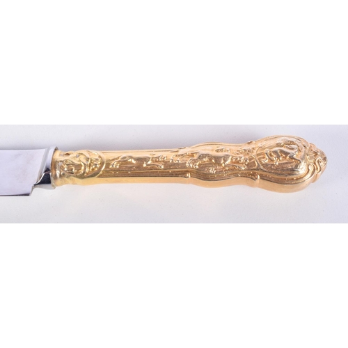 992 - A GILT KNIFE, FORK AND SPOON CHRISTENING SET.  21cm long, weight 186g (3)