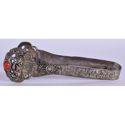 1512 - A PAIR OF EARLY 20TH CENTURY TIBETAN WHITE METAL TONGS inset with coral type stones. 15 cm long.