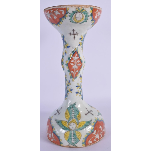 1515 - A LARGE OTTOMAN TURKISH KUTAHYA RELIGIOUS CANDLE STICK painted with figures. 24 cm high.