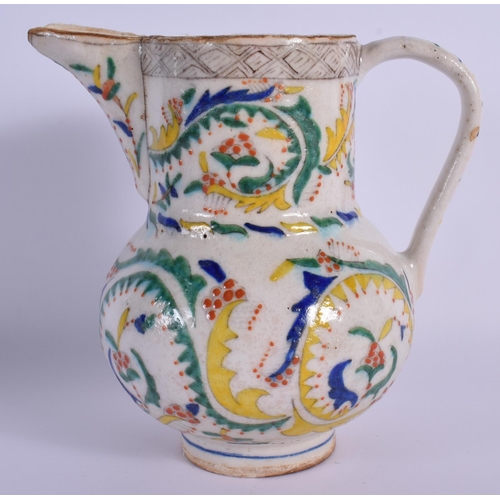 1516 - AN OTTOMAN TURKISH KUTAHYA HOLY WATER JUG painted with motifs. 16.5 cm high.