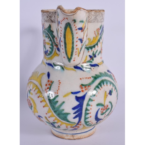 1516 - AN OTTOMAN TURKISH KUTAHYA HOLY WATER JUG painted with motifs. 16.5 cm high.