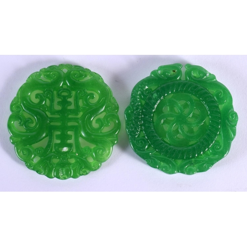 1526 - A CHINESE CARVED GREEN JADE PLAQUE 20th Century, together with another. 5 cm wide. (2)