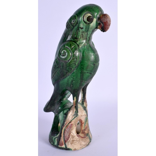 1541 - A CHINESE QING DYNASTY GREEN GLAZE FIGURE OF A PARROT modelled upon a naturalistic base. 21 cm high.