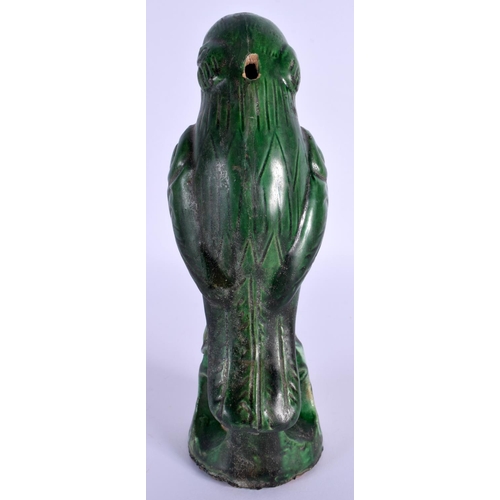 1541 - A CHINESE QING DYNASTY GREEN GLAZE FIGURE OF A PARROT modelled upon a naturalistic base. 21 cm high.