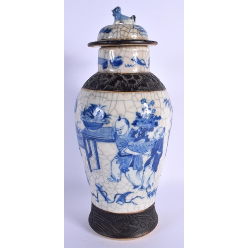 1543 - A LARGE 19TH CENTURY CHINESE CRACKLE GLAZED BLUE AND WHITE VASE AND COVER painted with figures. 30 c... 