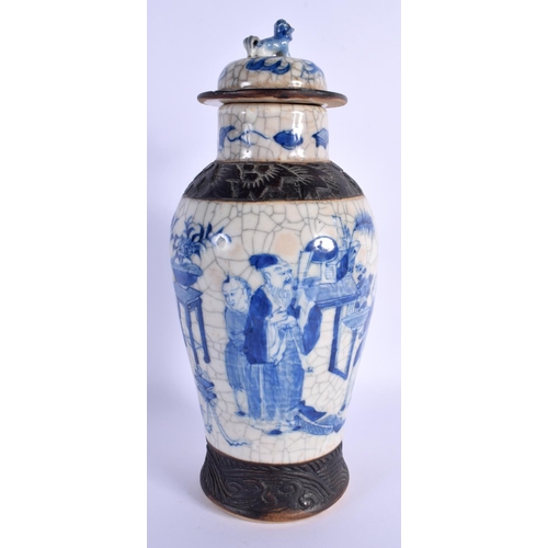 1543 - A LARGE 19TH CENTURY CHINESE CRACKLE GLAZED BLUE AND WHITE VASE AND COVER painted with figures. 30 c... 