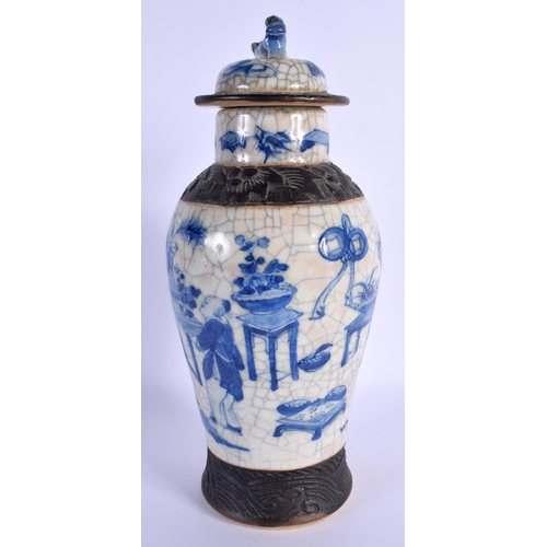 1543 - A LARGE 19TH CENTURY CHINESE CRACKLE GLAZED BLUE AND WHITE VASE AND COVER painted with figures. 30 c... 