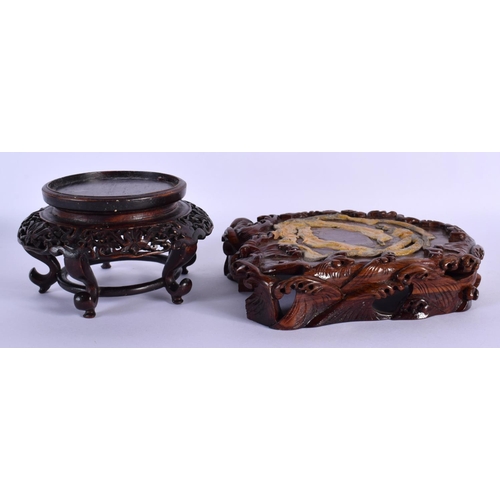 1560 - AN EARLY 20TH CENTURY CHINESE CARVED HARDWOOD STAND Late Qing/Republic, together with another wavy s... 