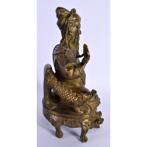 1575 - A CHINESE BRONZE FIGURE OF A SEATED GUARDIAN 20th Century. 23 cm x 11 cm.